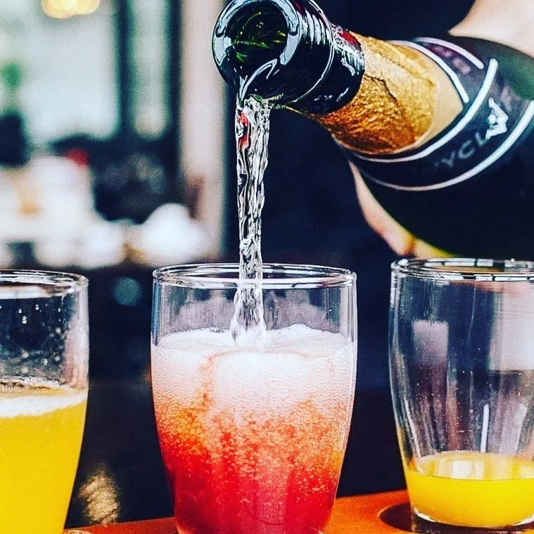 Mimosas being poured at Famous Toastery
